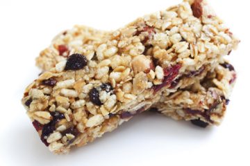 A photo of an energy bar with dried fruit and oats