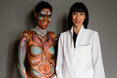 A portrait of a woman in face and body paint alongside oncologist Dr. Tessa Cigler