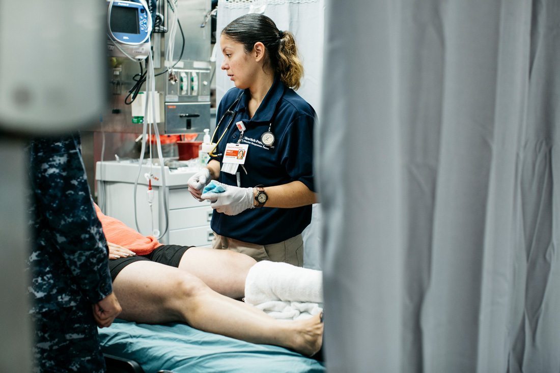 A clinical nurse treating a patient in Puerto Rico