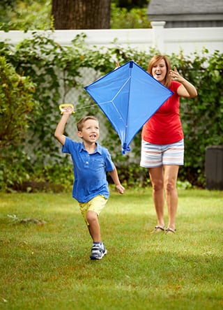 Cynthia Vander Molen flying a kite with son Jack