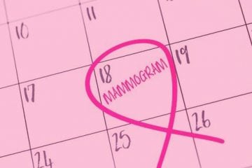 A pink calendar with a mammogram entry