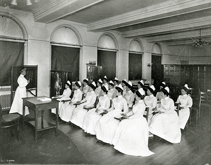 Photo of Anna Maxwell in classroom with nursing students.