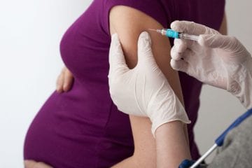 pregnant woman getting flu shot