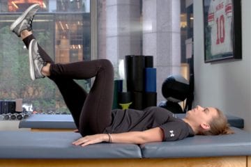 Woman demonstrating an exercise to help strengthen your core.