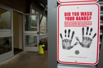 A sign reminding people to wash their hands