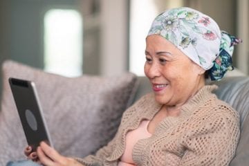 woman with cancer doing a telemedicine visit due to COVID-19 restrictions