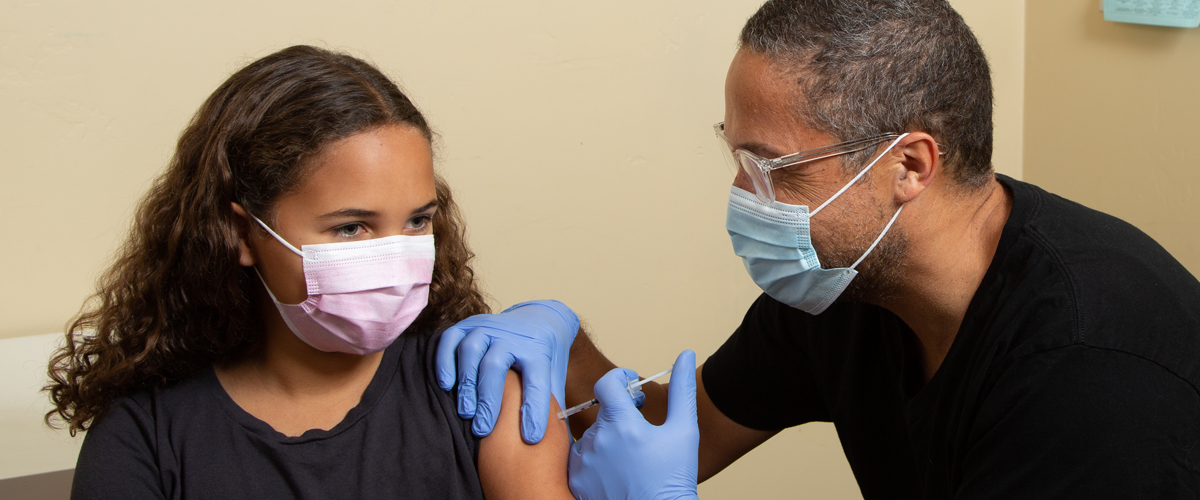 photo of kid getting the COVID-19 vaccine