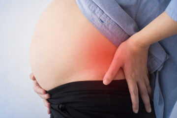 Woman having back pain during pregnancy
