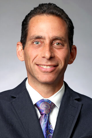 Headshot of Dr. Justin K. Greisberg