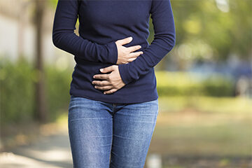 Woman holding stomach area