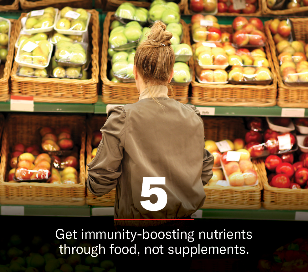 Woman grocery shopping to boost immunity with nutrients