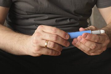 Person holding needle