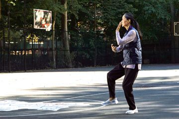 Woman doing tai chi in a park