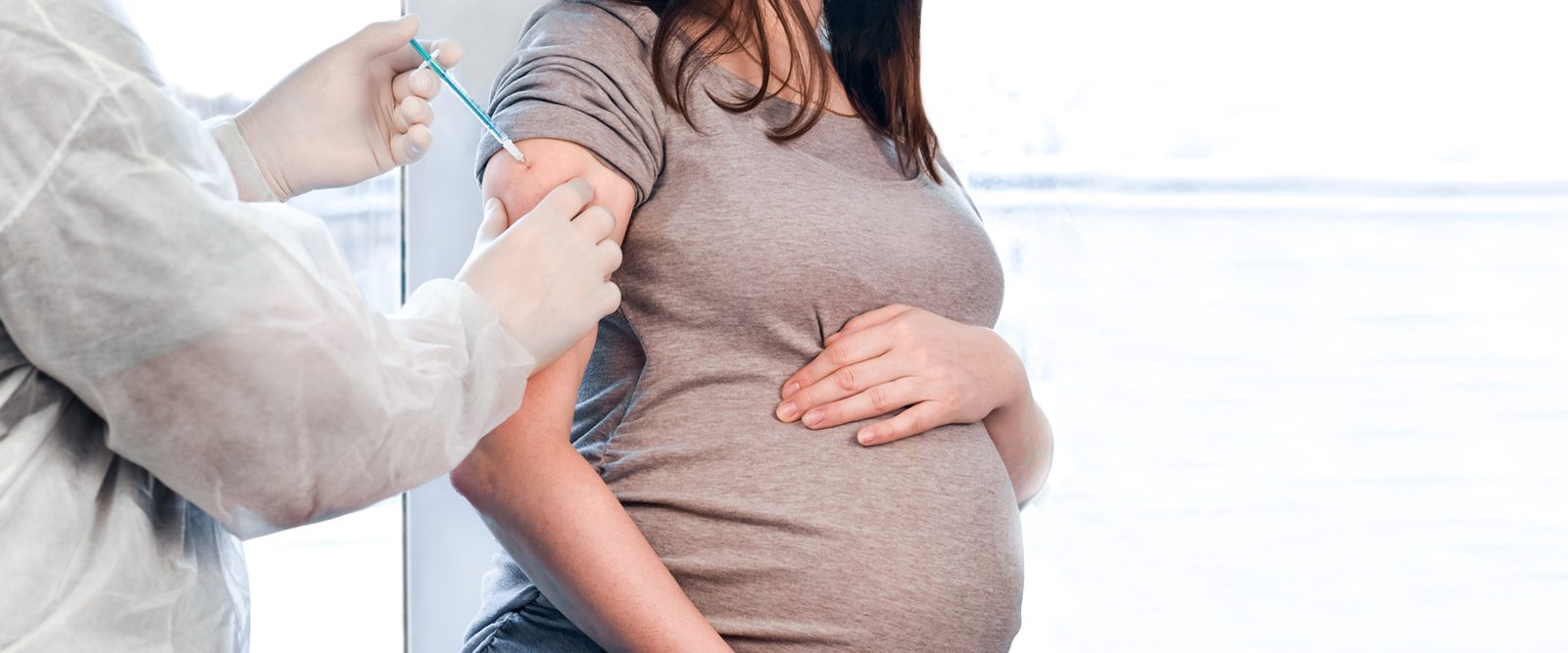 Pregnant woman getting a vaccine