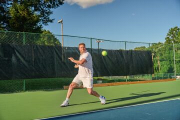 Mati Luik prepares to hit a tennis ball on the tennis court