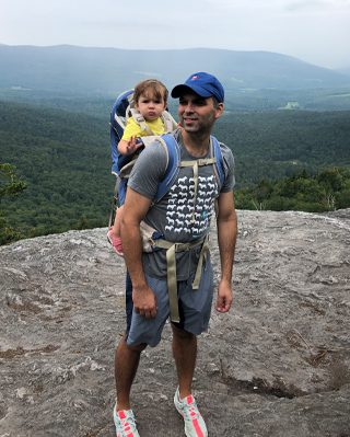 A man and his small child on a hike