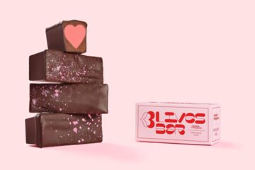 Chocolate bars stacked with a heart shaped strawberry ganache filling