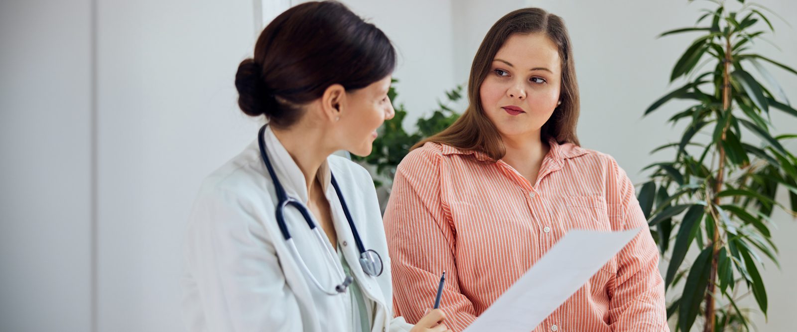 Doctor talking with patient about ovarian cancer and genetic testing