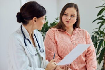 Doctor speaking with woman about ovarian cancer and genetic testing