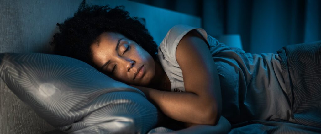 woman following good sleep tips and asleep in bed