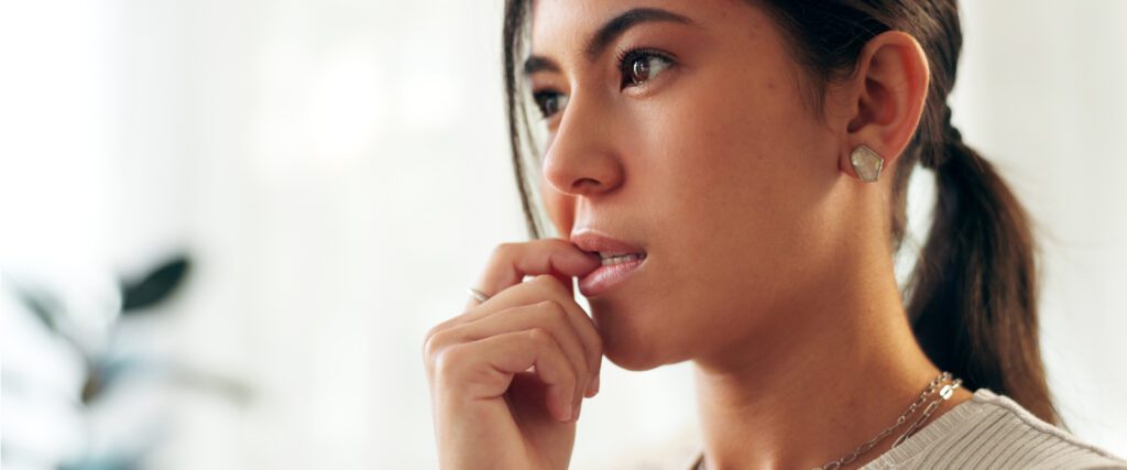 A person biting their nails.