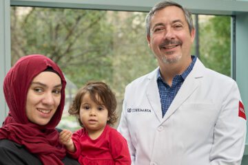 Portrait of ophthalmologist Dr. Brian Marr with patients