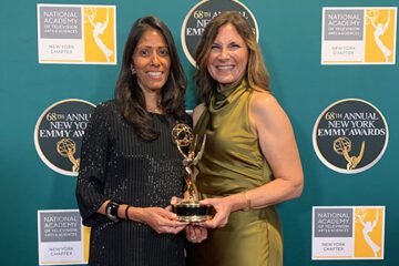 Devika Mathrani and Sharon Cotliar-Zweifach hold an Emmy Award