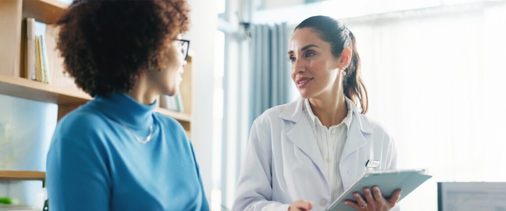 A doctor discussing medical results with a woman.