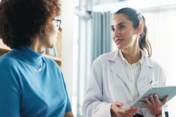 A doctor discussing medical results with a woman.