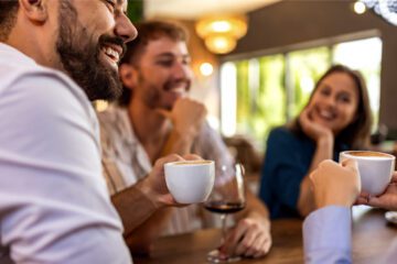 group of people drinking coffee and wine