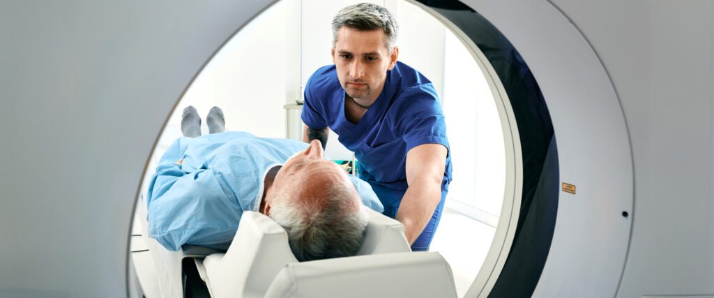 An older man getting an MRI.